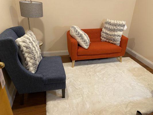 Therapist office with loveseat for couples.
