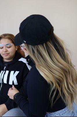 Adrianna with a client doing a brow lamination