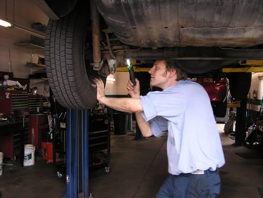 Tom inspecting axles for oil leak