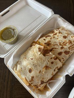 Burrito with birria and salsa verde