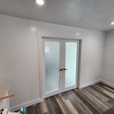 Framed to finish on a beautiful separation wall with gorgeous Sartodoors double French doors.