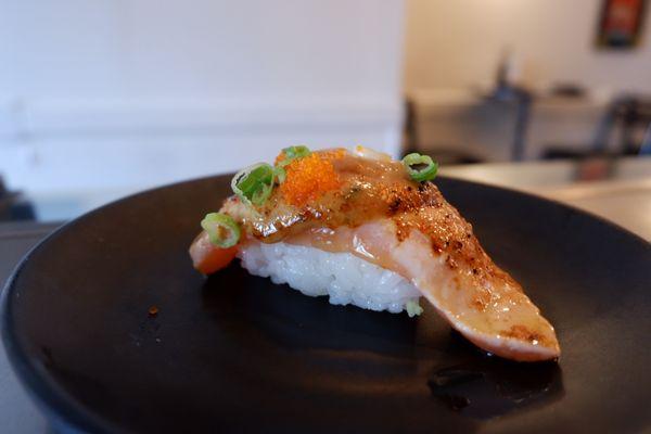 Seared salmon (aburi salmon) sushi.