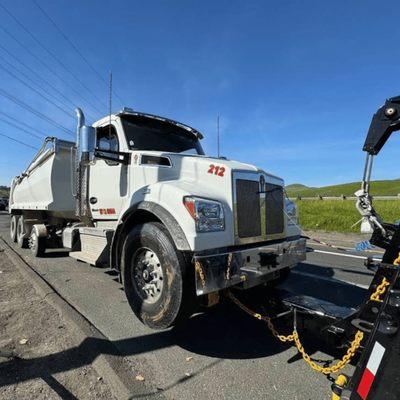 Heavy duty towing in West Covina recovering a disabled dump truck on the roadway