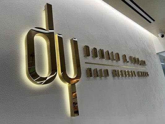 Halo illuminated logo with gold titanium finish