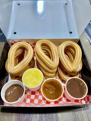 Olé Combo! 15 churros with Nutella, Bavarian Cream, Dulce de Leche and Spanish Hot Chocolate.