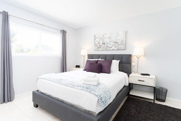 Our satin striped sheets with fluffy white towels