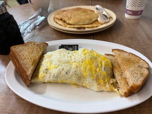 Western Omelet with wheat toast and a side of 2 pancakes