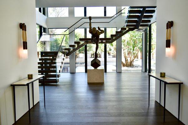 Custom finish on staircase finished by Austin Kerr to match the existing flooring