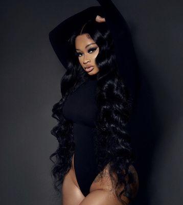 On of our Vixen in our Bodywave 13*4 lace front 30 inch wig