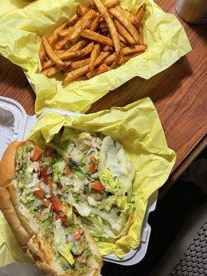 Under all that lettuce, tomato, beans, cheese, and guacamole is a whole bunch of tri-tip meat as well!