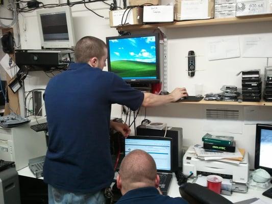 Multiple technicians working close to eachother.