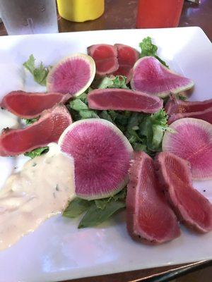 Seared tuna appetizer with radish-like somethings