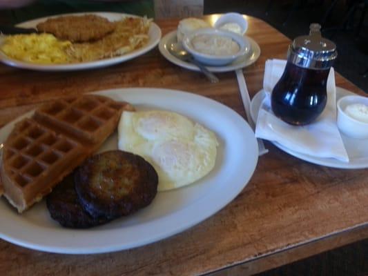 Half waffle breakfast with sausage patties