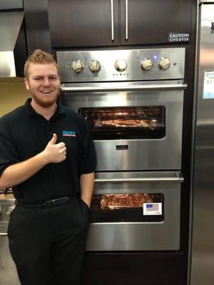 Ryan Cooking Pizza and cookies on a Viking Double oven.