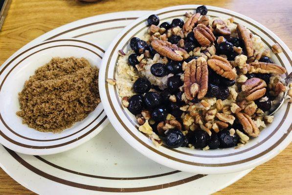 Oatmeal with blueberries and nuts with a side of brown sugar