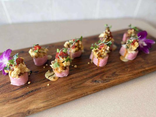 "Kiss Roll" Spicy Tuna, Avocado, Wrapped in Soy Papper, topped with Crispy Escolar, Chef's Special Sauce and Tobiko.