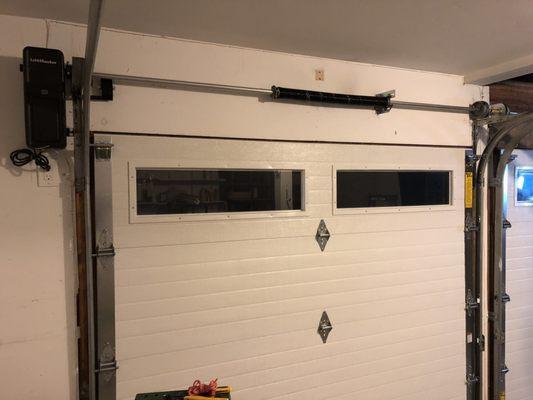 Garage door torsion spring and lift master wall mounted garage door opener