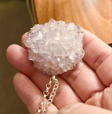 The amethyst stalactite cluster represents the very tip of the stalactite