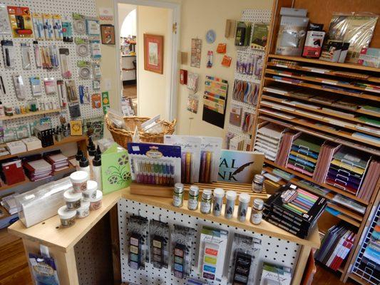 In the Paper Room you'll find paper/cardstock, glues and adhesives, quilling tools, glitter, stickers, stamps, ink and embellishments galore