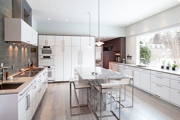 White is the star in this bright modern kitchen, but a variety of textures and tones round out the cast.