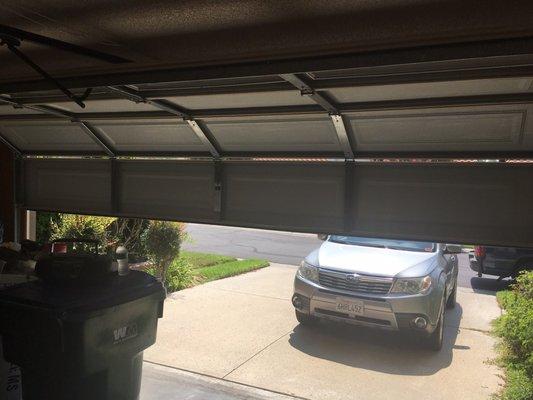 After picture of our fixed garage door. 20 minutes later. Very happy.
