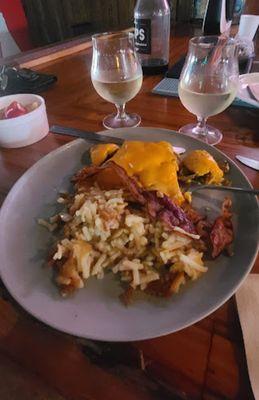 Build your own omelet, hash browns and bacon, fresh fruit and mimosas, minus the juice... (no toast for my celiac wife!