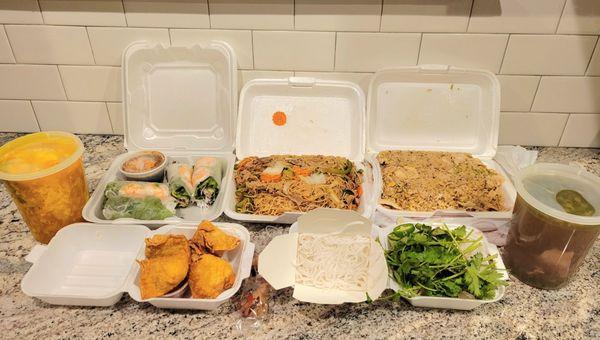 Egg drop soup, shrimp & pork spring rolls, thin rice noodles with beef, pork fried rice, beef pho soup, complimentary crab Rangoons