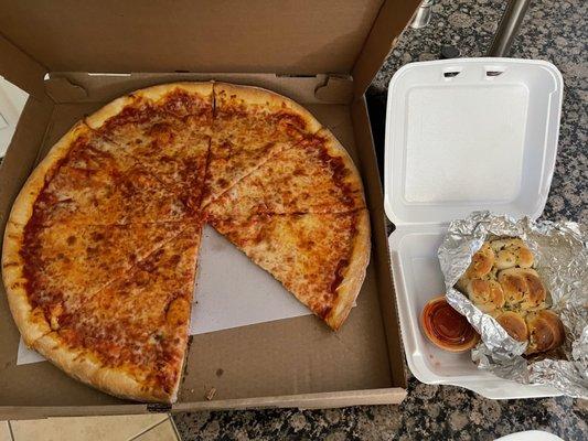 Large cheese pizza $15 and super tiny 1"x1" bite size garlic "knots" $4.