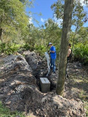 Hand hole with underground main service feeder installation