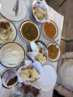 Naan, Butter chicken, Lamb Mughlai, Vegetable korma. Samosas, Vegetable Pakora. Side of red onion & chilies
