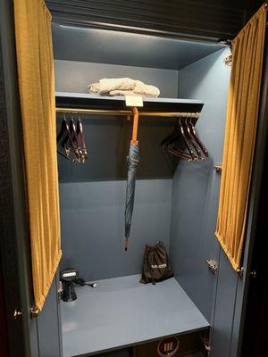 Closet with umbrella and robe to use while here or can purchase.