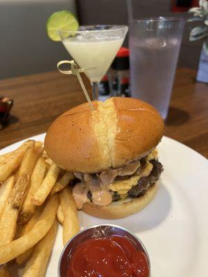 Smash burger with Cajun fries and a lemon drop martini