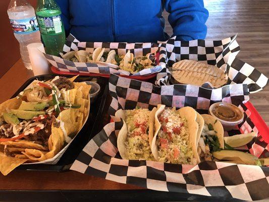 Loaded nachos, quesadilla, and a variety of tacos.