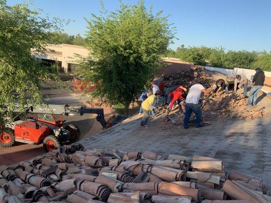 Teen Challenge Students demoing a roof for Exterior Renovations.