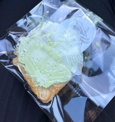Melon cream tart in a tiny bag after being forcefully squished