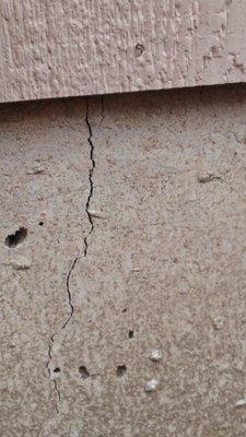 Foundation settlement crack on new home.