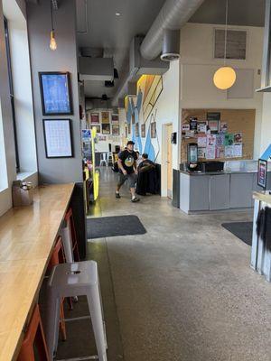 Tables to seat at and high tops looking out window for seating