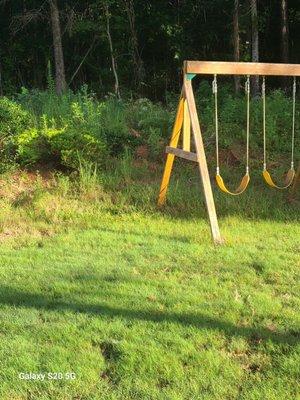 This is my backyard around my grandbaby's swing. Set the lawn care only spray's half of my backyard