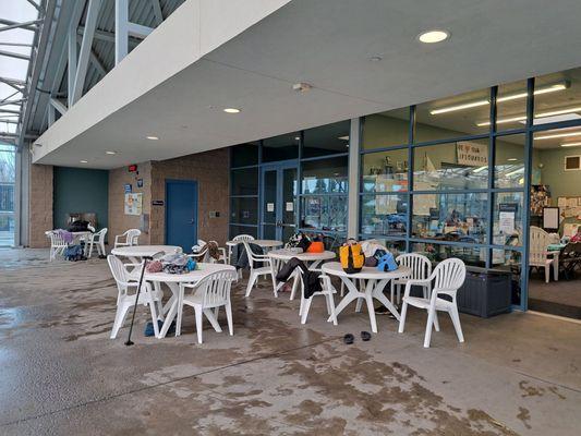 Patio tables and chairs by the pool