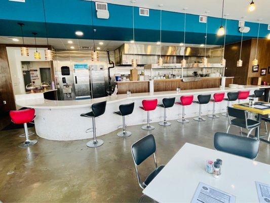 Diner counter, dining space, & open kitchen