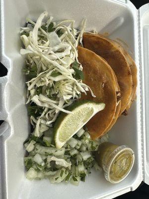 2 birria tacos on corn