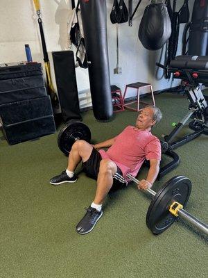 Client Kun working on glute bridges
