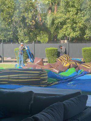 Crew removing blow up, sad kids not pictured. Thanks Anna!