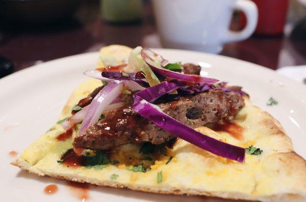 Lamb Seekh Kebab on top of Garlic Naan