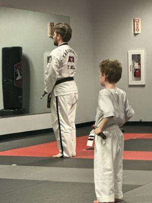 Our son learning the nunchuck routine with his teacher, Mr. Bell.