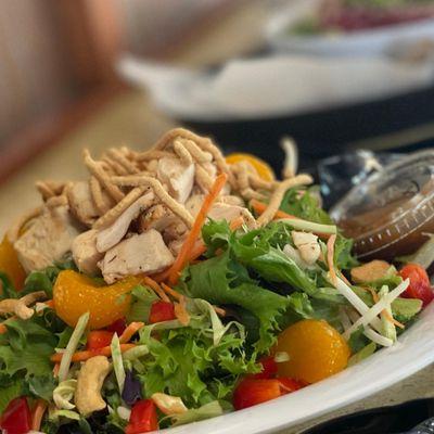 Asian Chicken salad:
Super greens, roasted all-natural chicken breast, mandarin oranges, cucumbers, red peppers, peanuts and crispy noodles