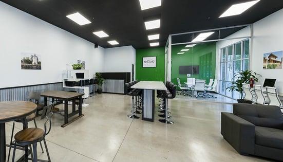 Contemporary open office interior for iRealty. Stop by for a visit!