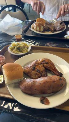 Front: Grilled chicken, sweet potato, cabbage, roll Back: pork chop, mashed potatoes with gravy, broccoli & cheese casserole, cornbread