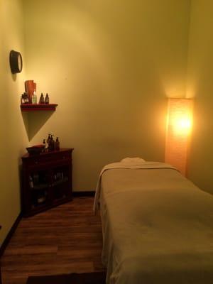 Cozy treatment room, outfitted with comfy, heated massage table & ambient lighting to help you drift into relaxation.