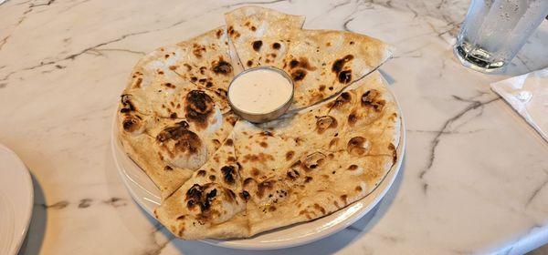 Traditional leavened white flour soft bread in the tandoori
